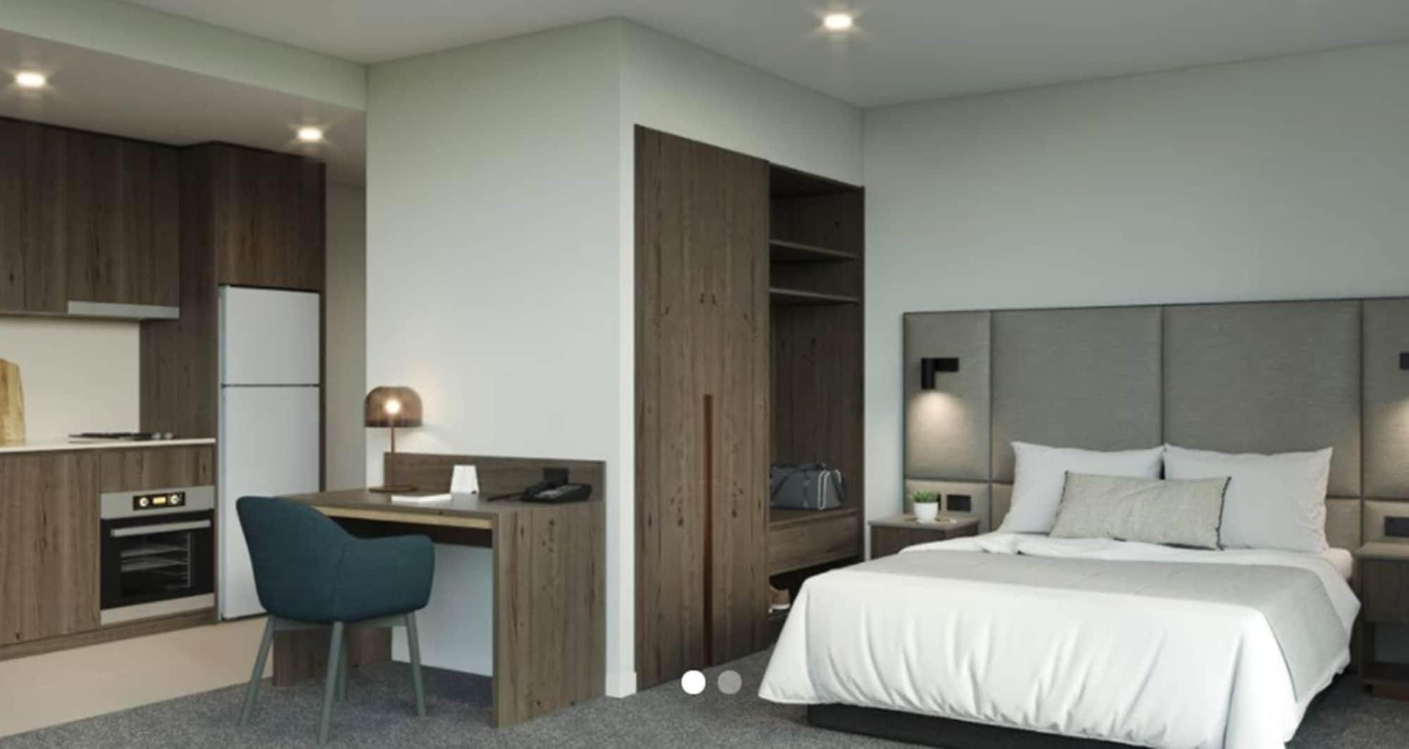 Oakwood Premier Melbourne Aparthotel Buitenkant foto A typical bedroom at the hotel
