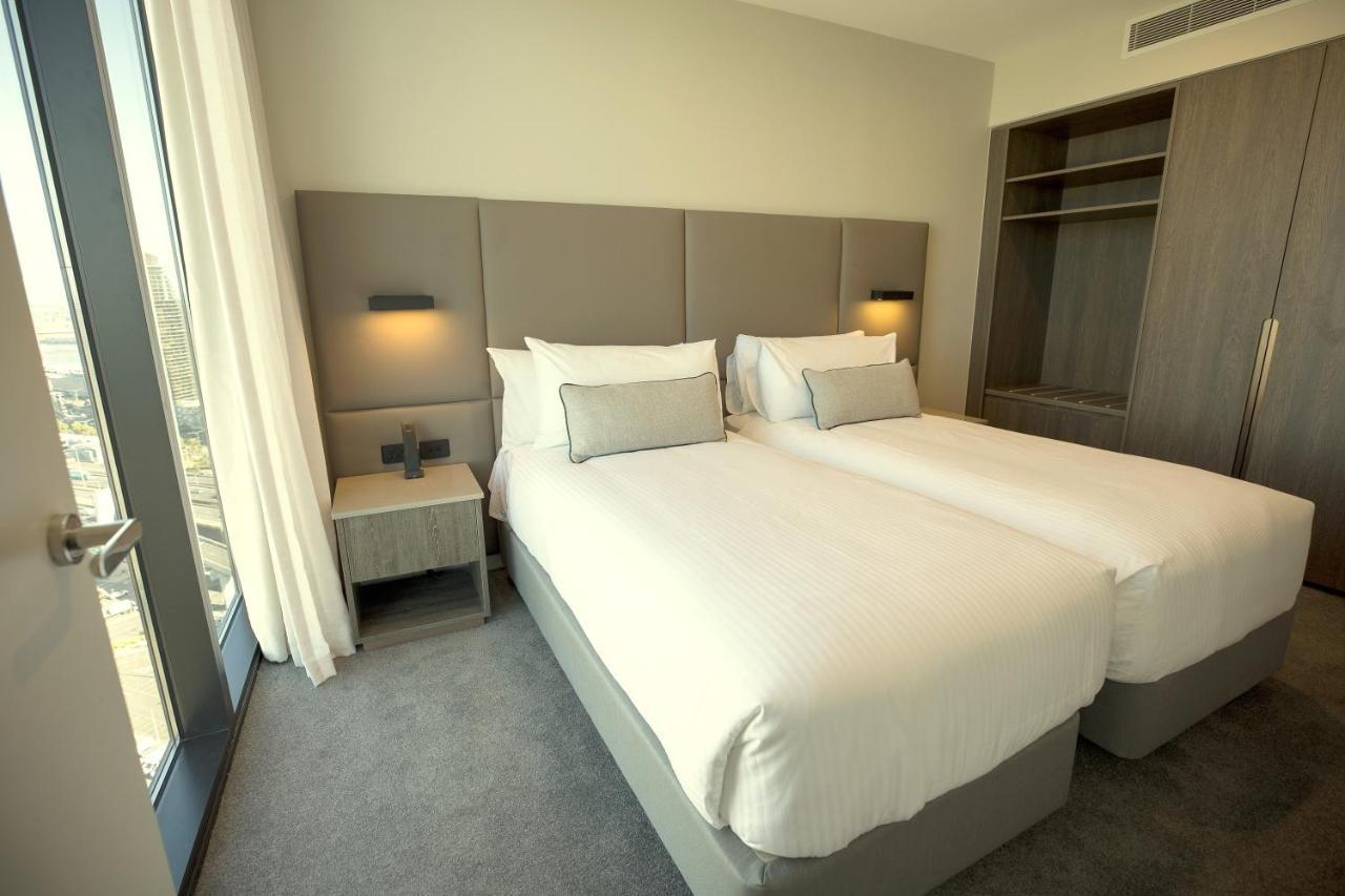 Oakwood Premier Melbourne Aparthotel Buitenkant foto A bedroom at the hotel